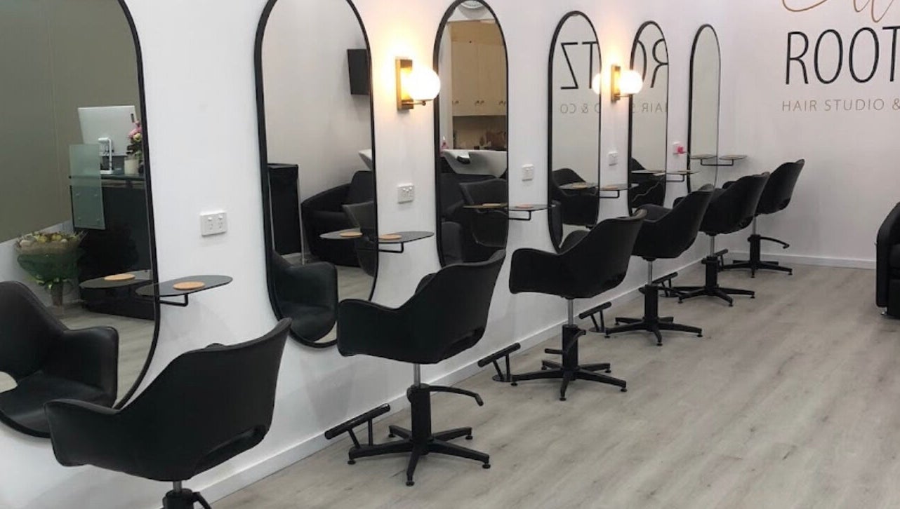 Sleek salon setup at Celtic Rootz & Co, Bangor, New South Wales, AU, featuring stylish black chairs.
