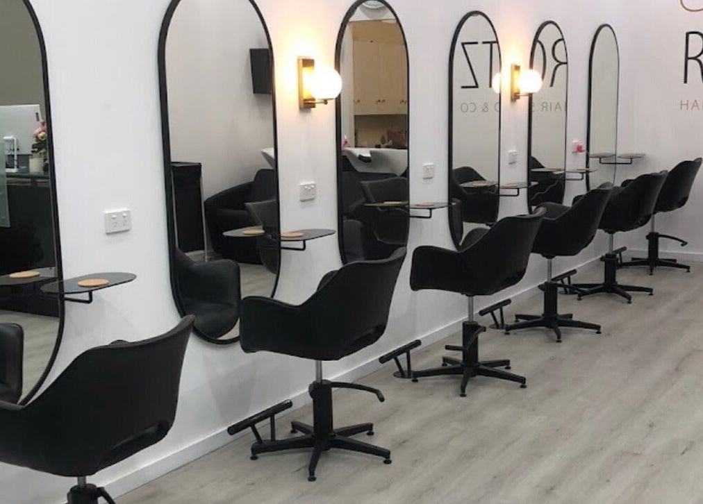 Sleek salon setup at Celtic Rootz & Co, Bangor, New South Wales, AU, featuring stylish black chairs.