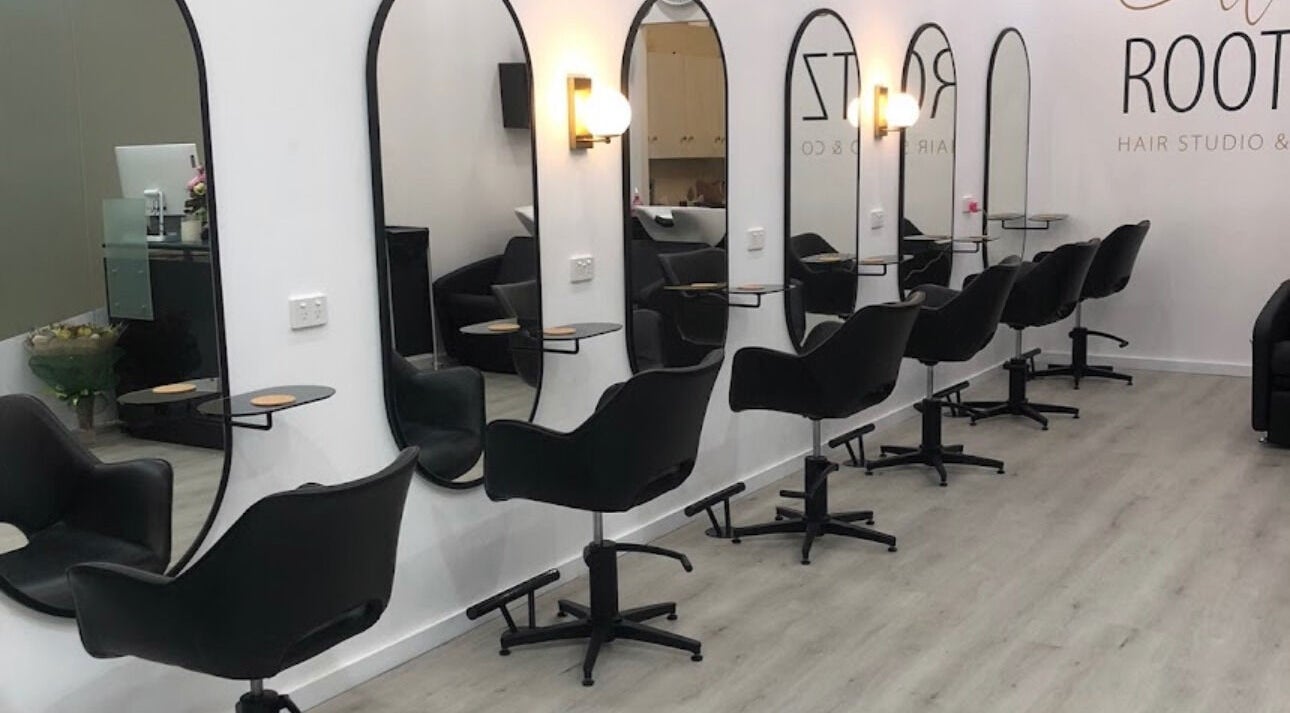 Sleek salon setup at Celtic Rootz & Co, Bangor, New South Wales, AU, featuring stylish black chairs.