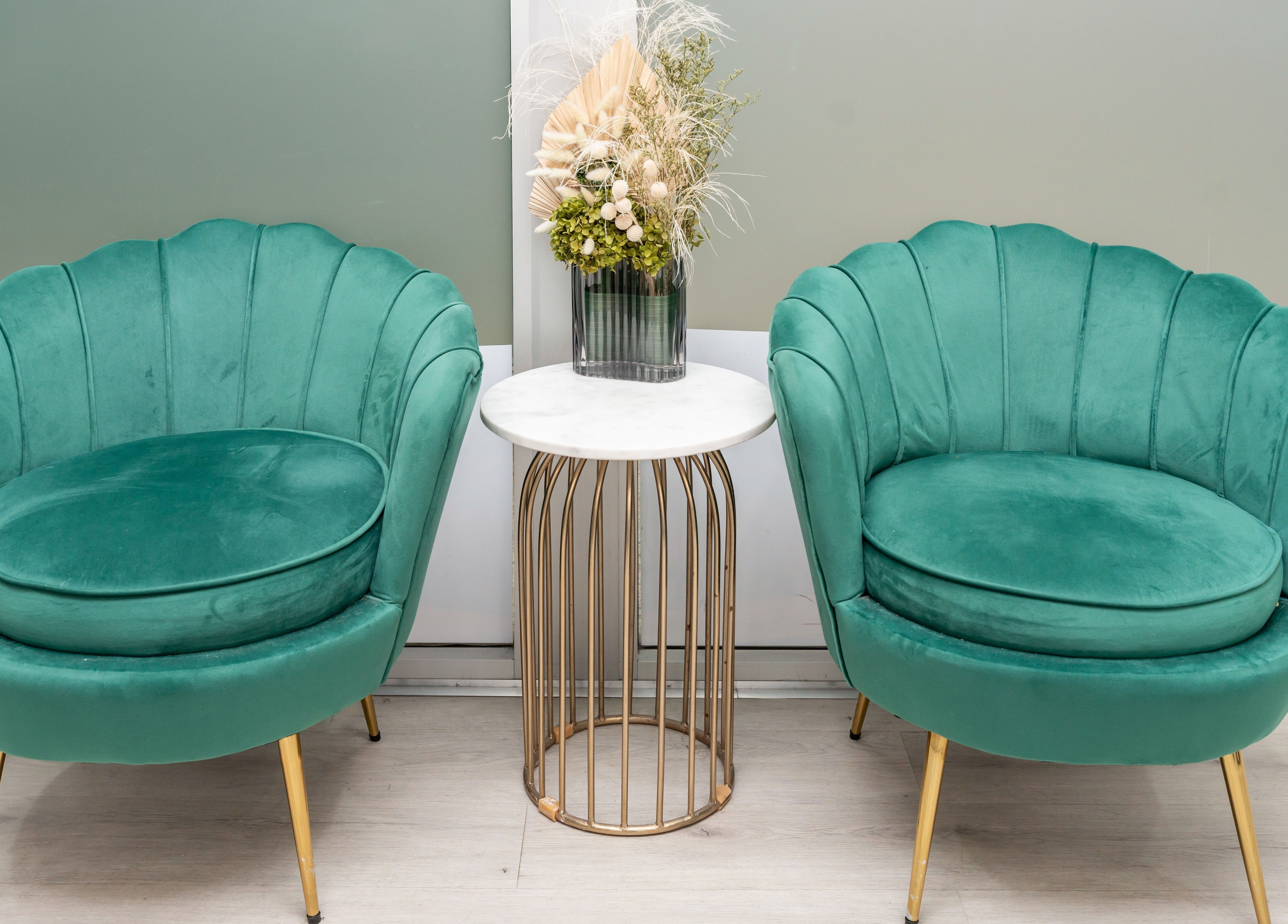 Elegant green chairs at Celtic Rootz & Co, Bangor, New South Wales, AU, enhancing a chic, relaxing atmosphere.