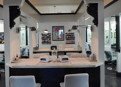 Interior of Hair By Jessie G in Hedgesville, WV, US, featuring modern styling stations and chic decor.
