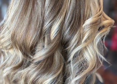 Elegant wavy blonde hair at Hair By Jessie G in Hedgesville, West Virginia, US.