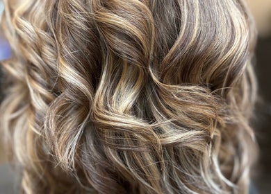 Stylish wavy hairstyle at Hair By Jessie G in Hedgesville, West Virginia, US.