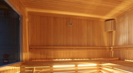 Luxurious sauna room at Payam Spa & Wellness in Antalya, Antalya, TR, featuring warm wooden interiors.