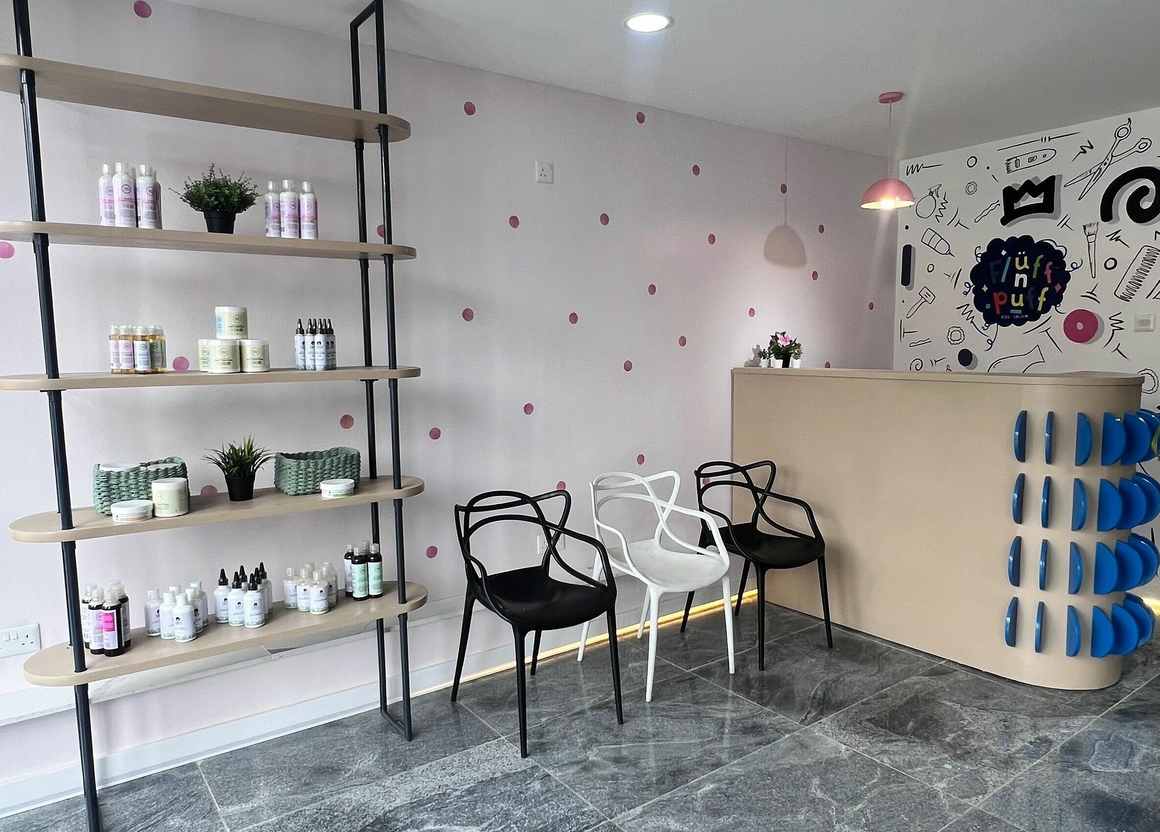 Modern reception area at Fluff n Puff, Lekki, Lagos, NG with stylish chairs and product shelves.