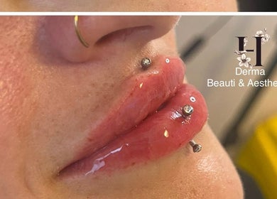 Close-up of lip art with piercings at H Derma Beauti Aesthetics Norwich, Norwich, England, GB.