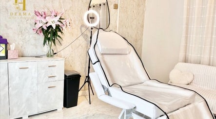 Modern aesthetic treatment room at H Derma Beauti Aesthetics Norwich, Norwich, England, GB. Plush chair and soft decor.