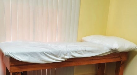 Massage table at Liv Ayurveda Parramatta, Parramatta, New South Wales, AU, offering relaxing treatments.