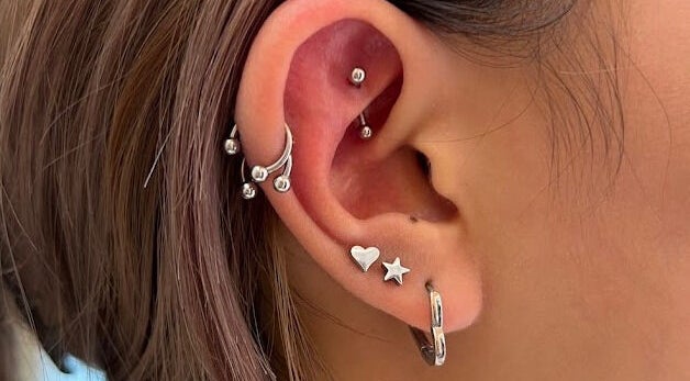 Silver earrings from Serendipity Accessories, Upper Mount Gravatt, Queensland, AU, showcasing unique piercings.