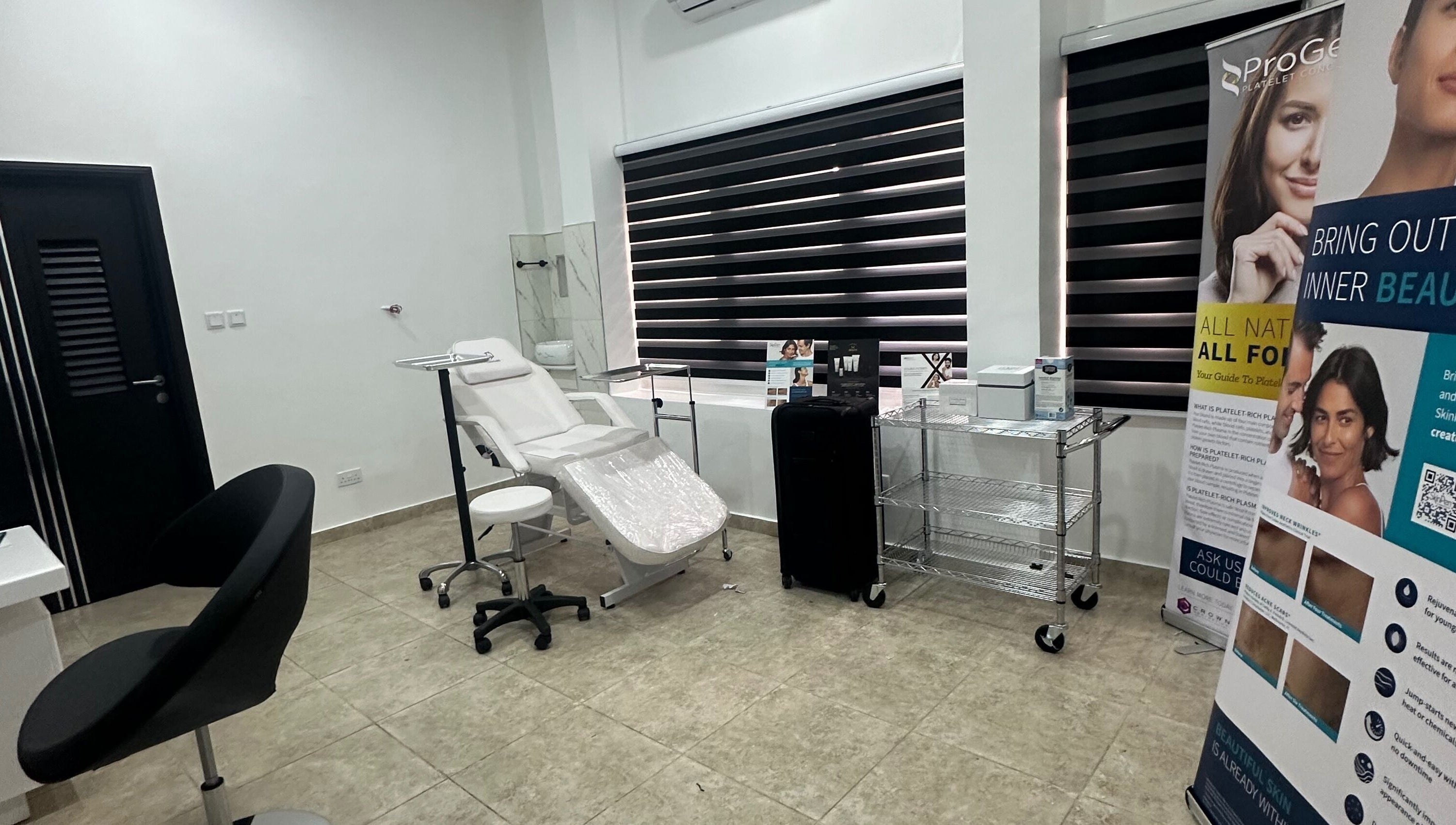 Serene treatment room at Care360 Aesthetics and Wellness, Lagos, NG, featuring modern equipment and stylish decor.