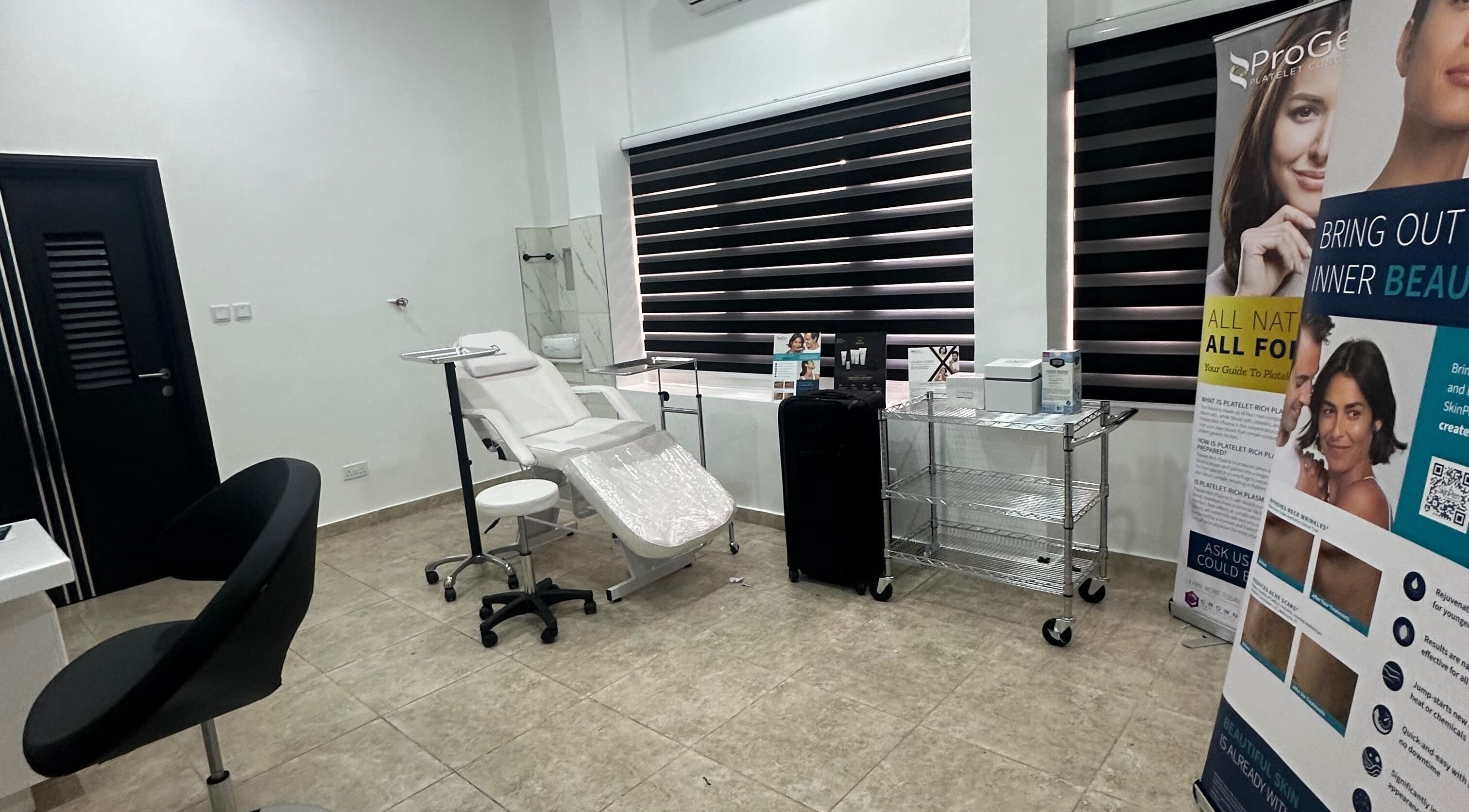 Serene treatment room at Care360 Aesthetics and Wellness, Lagos, NG, featuring modern equipment and stylish decor.