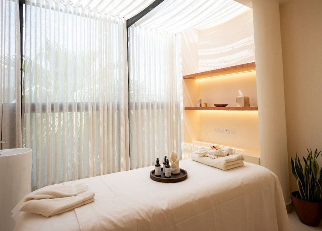 Tranquil room at Zen Spa I زن سبا with soft lighting and massage table in Riyadh, Riyadh Province, SA.