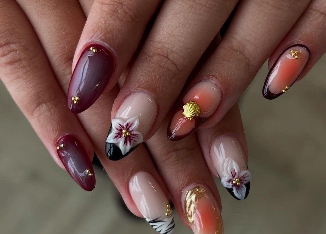 Stylish floral nail art at Pura Vida Salon, Plymouth, England, GB, showcasing elegant design and creativity.