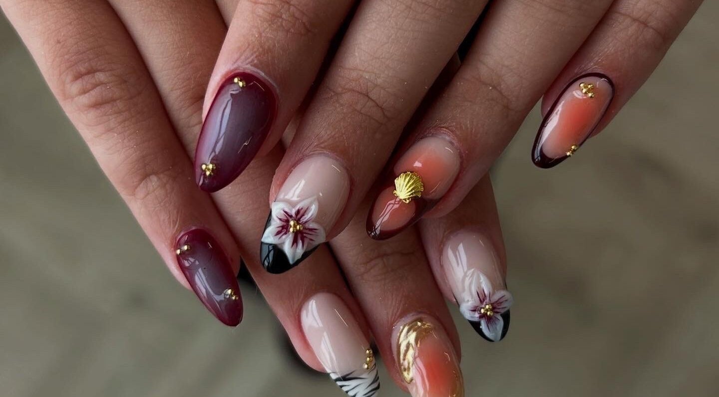 Stylish floral nail art at Pura Vida Salon, Plymouth, England, GB, showcasing elegant design and creativity.