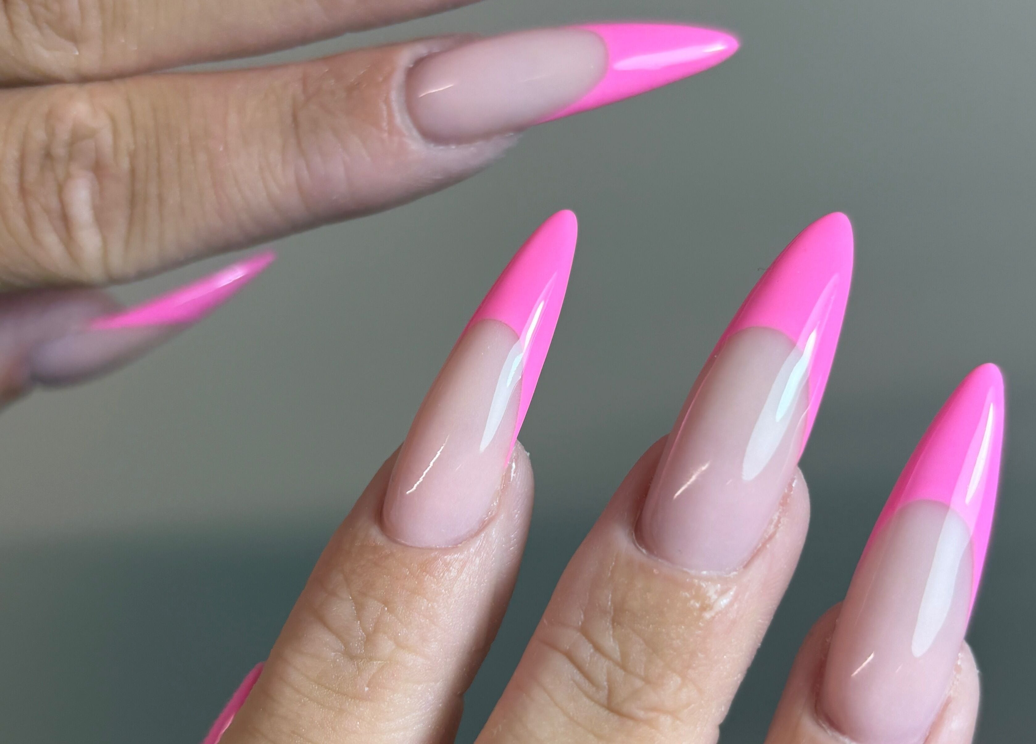 Elegant pink stiletto nails at Pura Vida Salon, Plymouth, England, GB showcasing expert nail artistry.