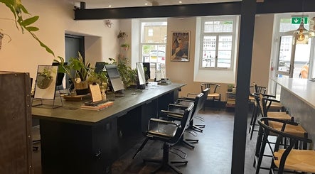 Craft Hairdressing in Tring, England, GB, featuring stylish salon chairs and modern decor.