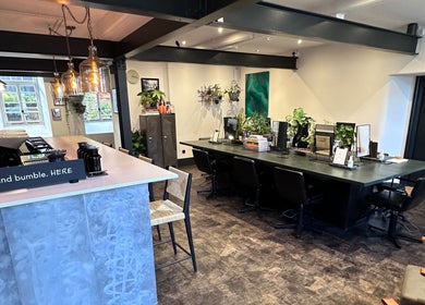 Elegant interior of Craft Hairdressing in Tring, England, GB, featuring stylish decor and modern workspace.