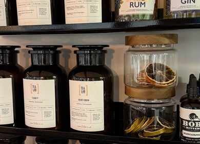 Craft Hairdressing's elegant shelf with teas and bitters, Tring, England, GB. Perfect blend of aesthetics.