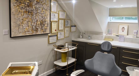 Elegant treatment room at Alisha's Aesthetics in Guernsey, Saint Peter Port, GG with certifications displayed.