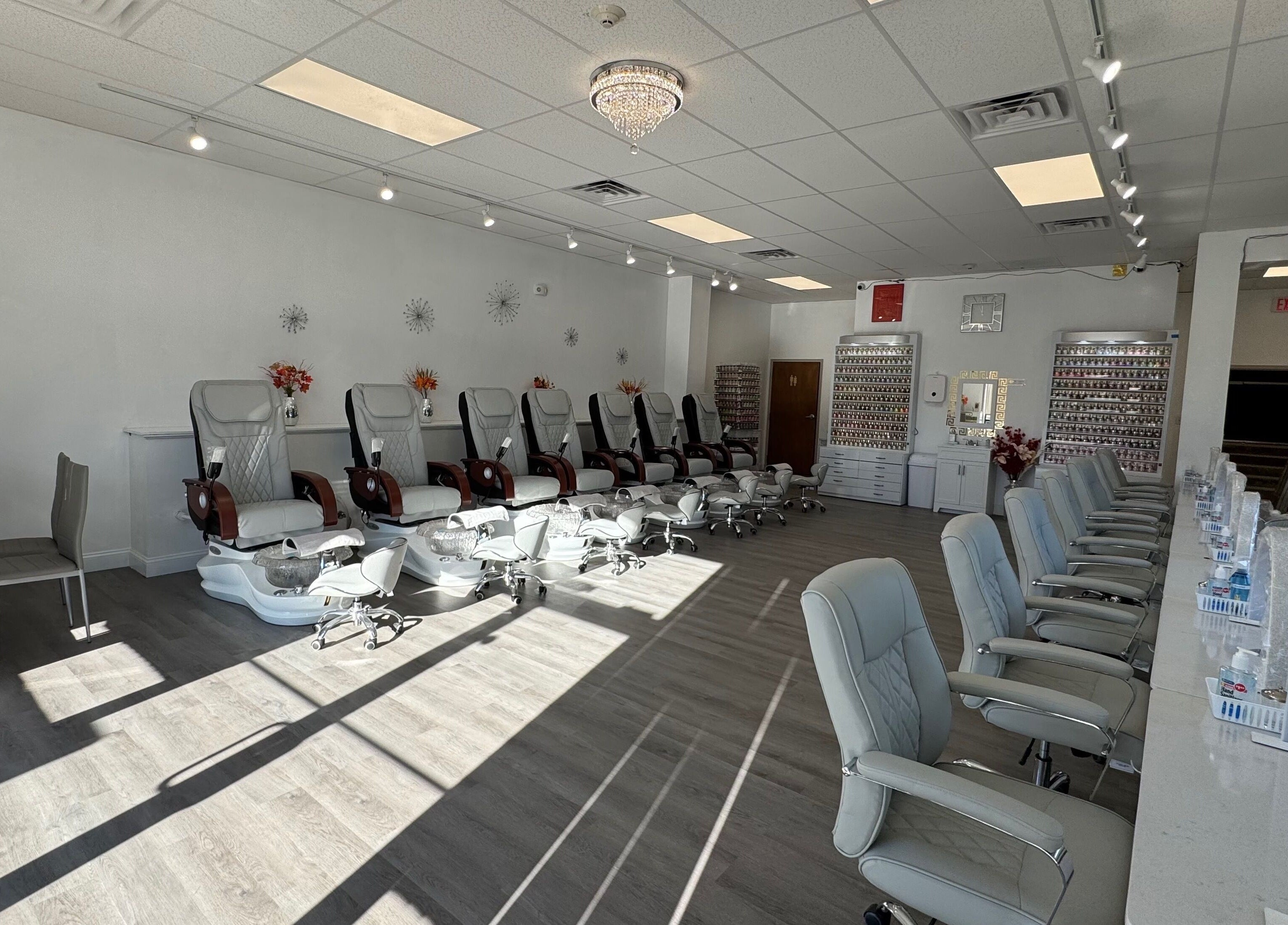 Spacious and modern interior of D Nails and Spa Dracut in Dracut, Massachusetts, US, featuring comfortable seating.