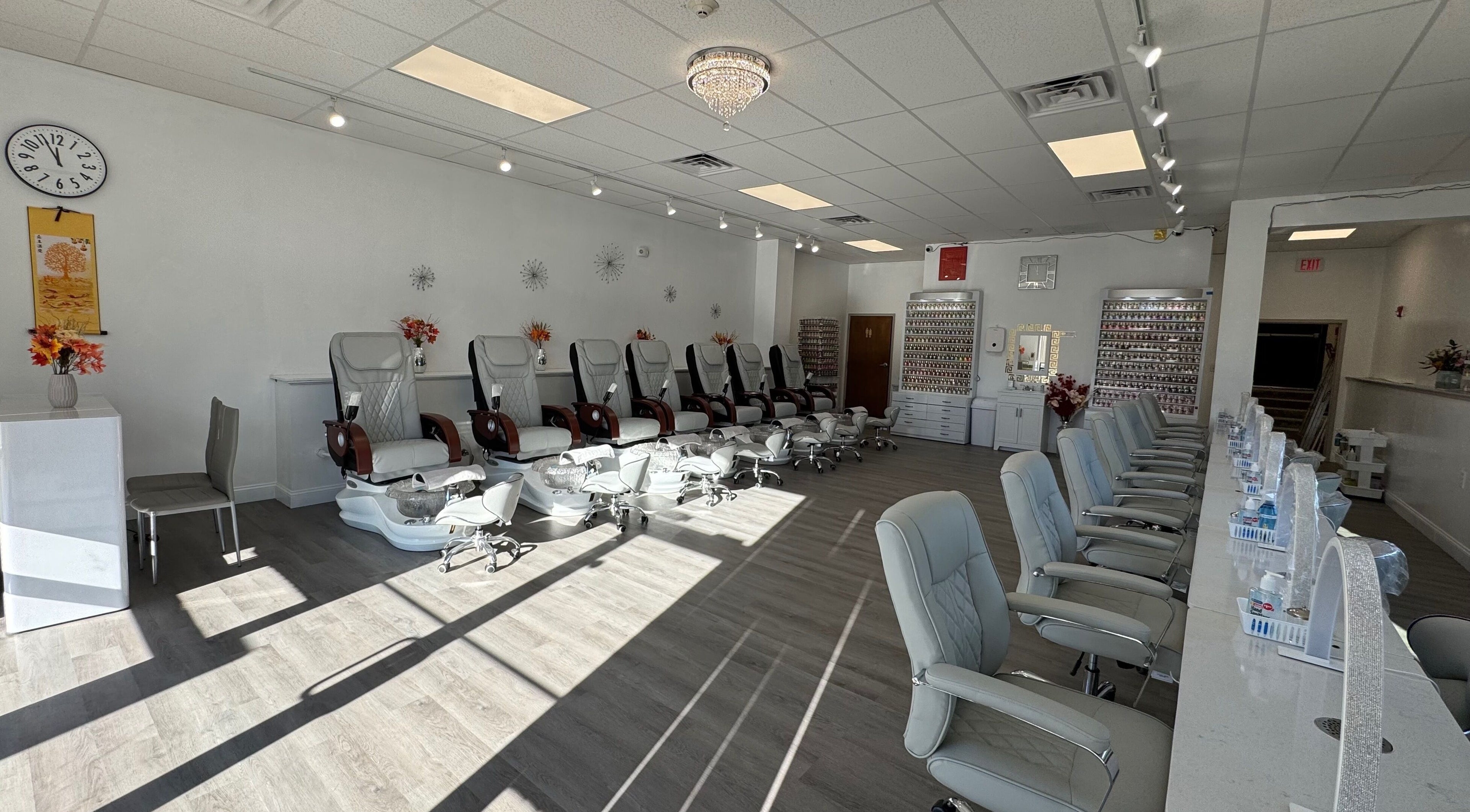 Spacious and modern interior of D Nails and Spa Dracut in Dracut, Massachusetts, US, featuring comfortable seating.
