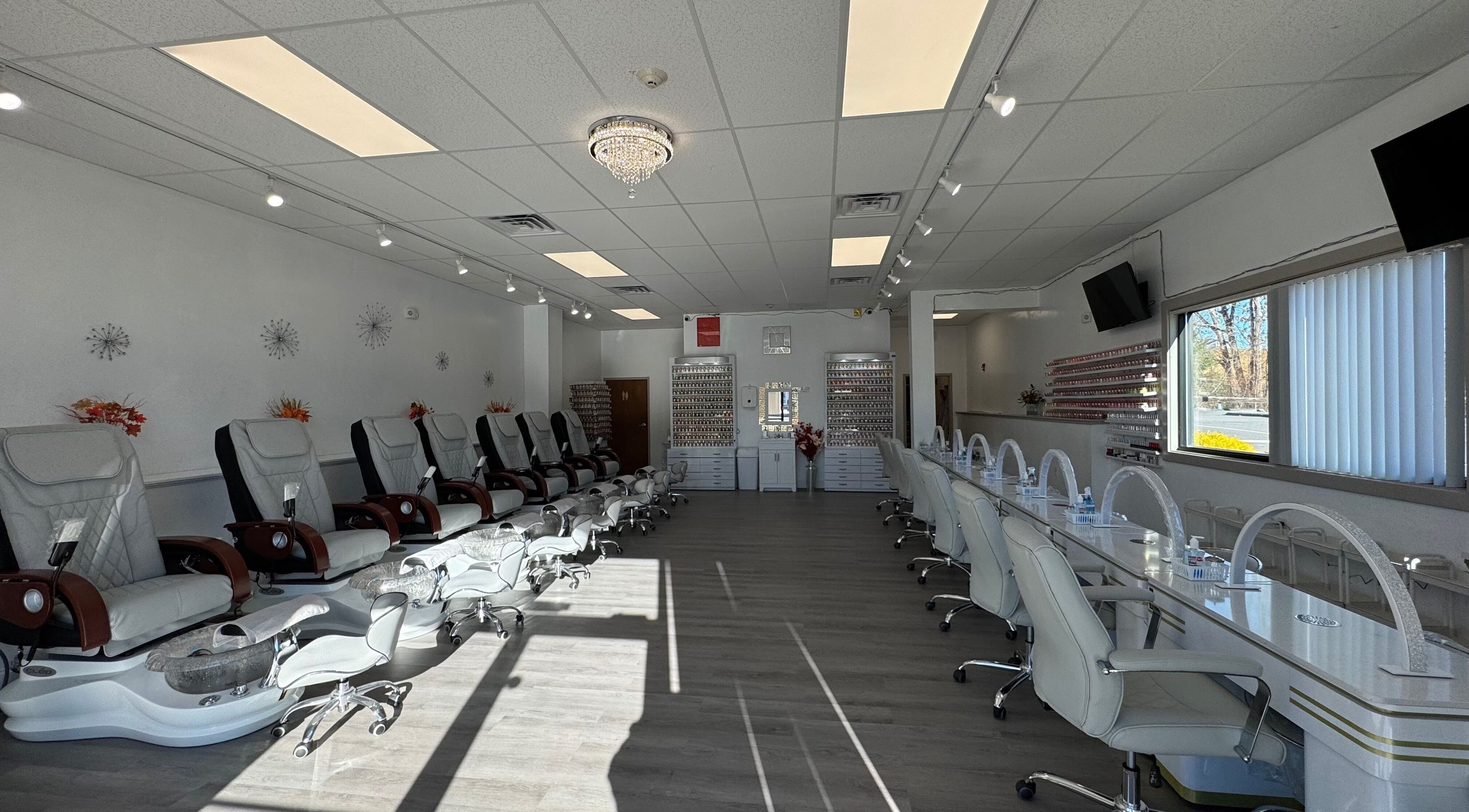 Spacious interior of D Nails and Spa Dracut with pedicure chairs, Dracut, Massachusetts, US.