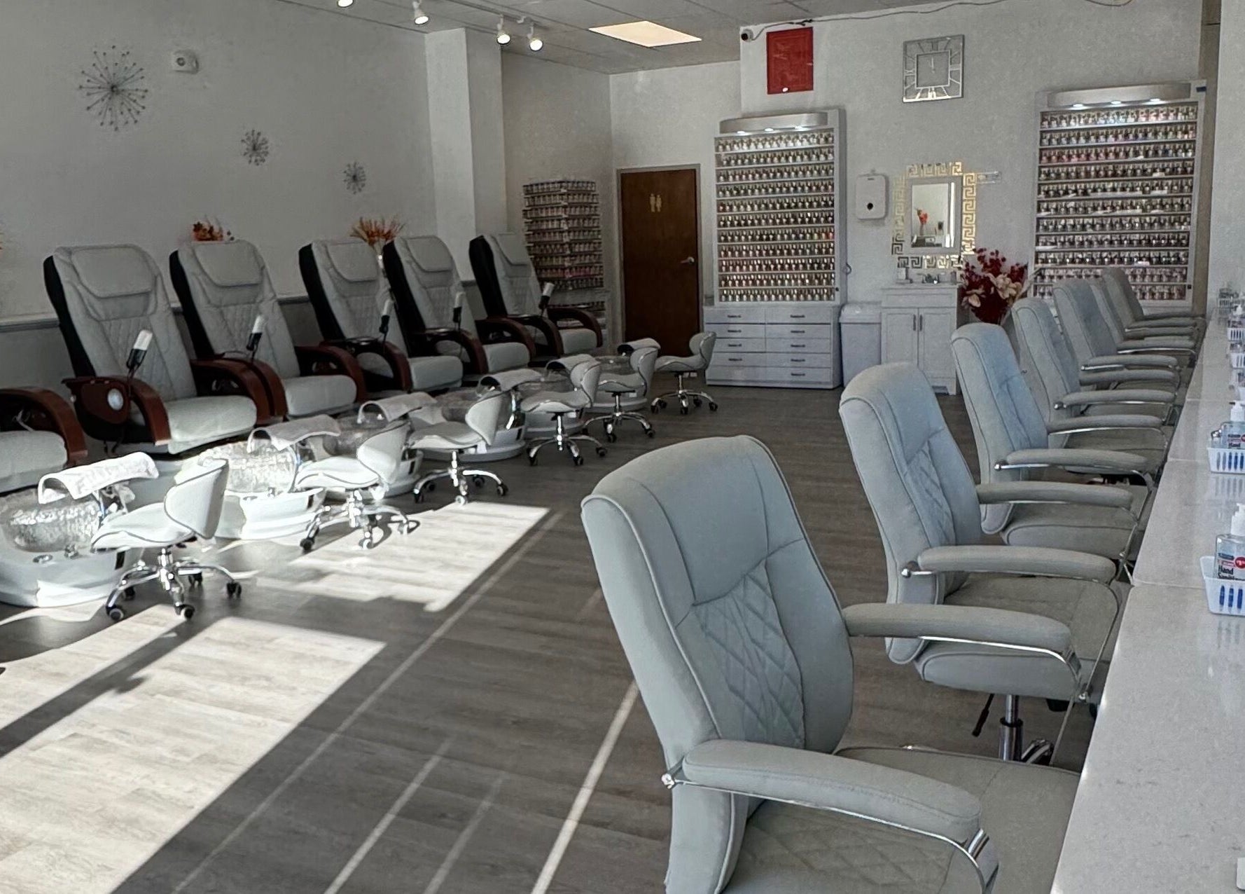 Elegant interiors at D Nails and Spa Dracut in Dracut, Massachusetts, US featuring modern pedicure stations.