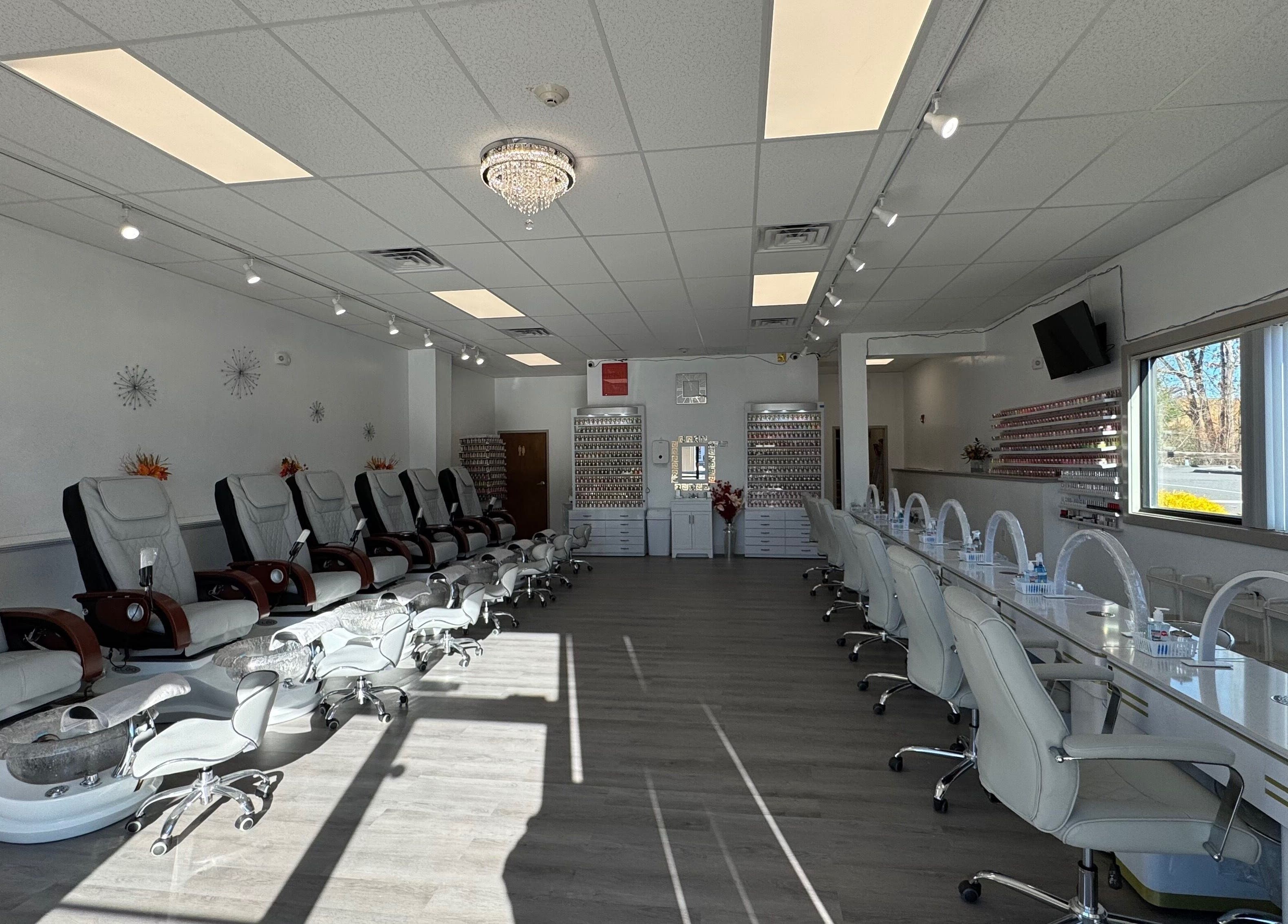 Elegant interior of D Nails and Spa Dracut with plush chairs, located in Dracut, Massachusetts, US.