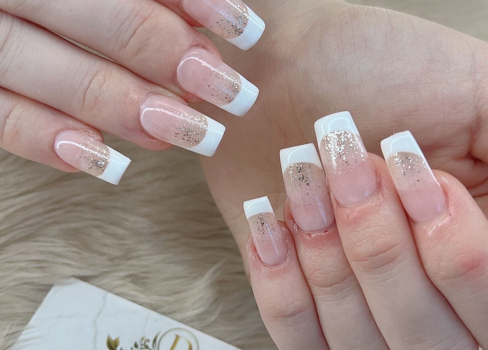 Glittery French manicure at D Nails and Spa Dracut, Dracut, Massachusetts, US.