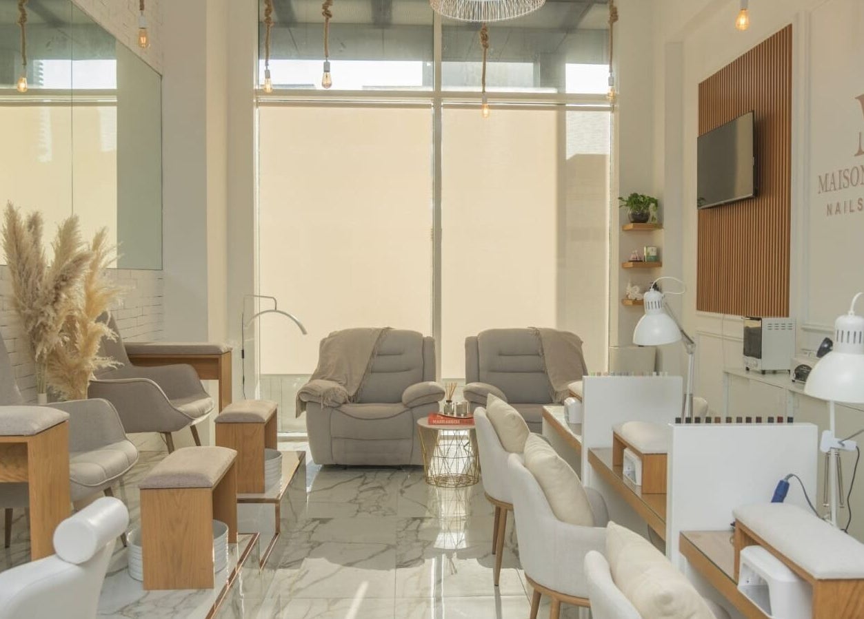 Elegant interior of Maison Ferdaous Nails & Lashes in Dubai, Dubai, AE featuring plush seating and stylish decor.