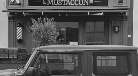 Front entrance of il-Mustaċċun Barber in Ħal Lija, MT, featuring a classic barbershop look.