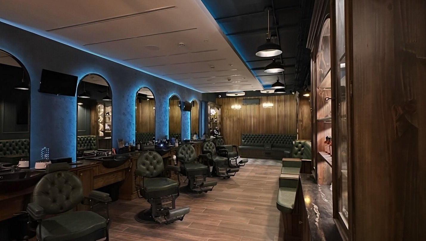 Luxurious interior of il-Mustaċċun Barber in Ħal Lija, MT with vintage chairs and modern decor.