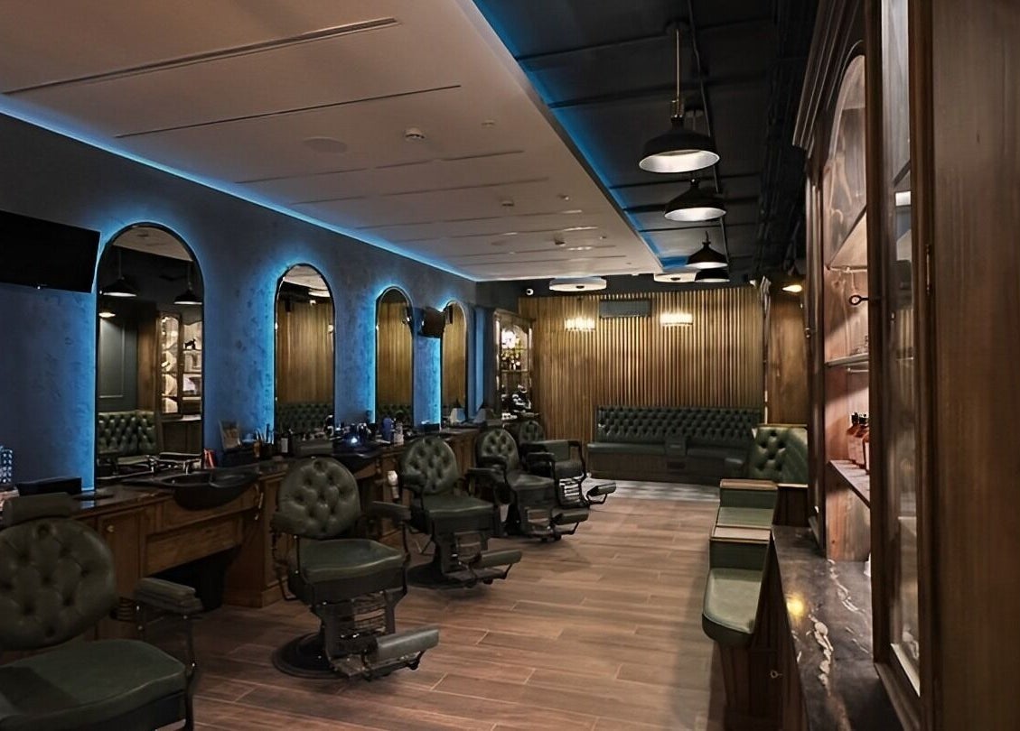 Luxurious interior of il-Mustaċċun Barber in Ħal Lija, MT with vintage chairs and modern decor.