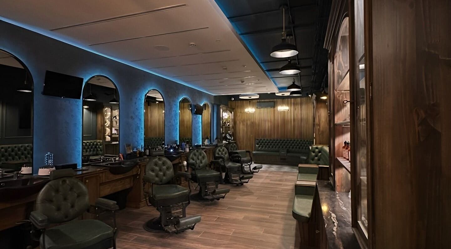 Luxurious interior of il-Mustaċċun Barber in Ħal Lija, MT with vintage chairs and modern decor.