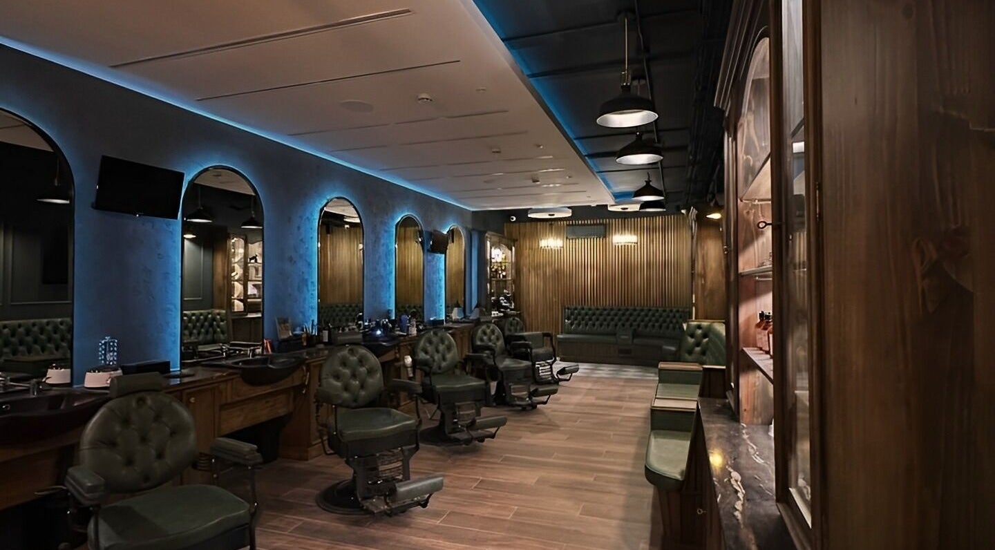 Luxurious interior of il-Mustaċċun Barber in Ħal Lija, MT with vintage chairs and modern decor.