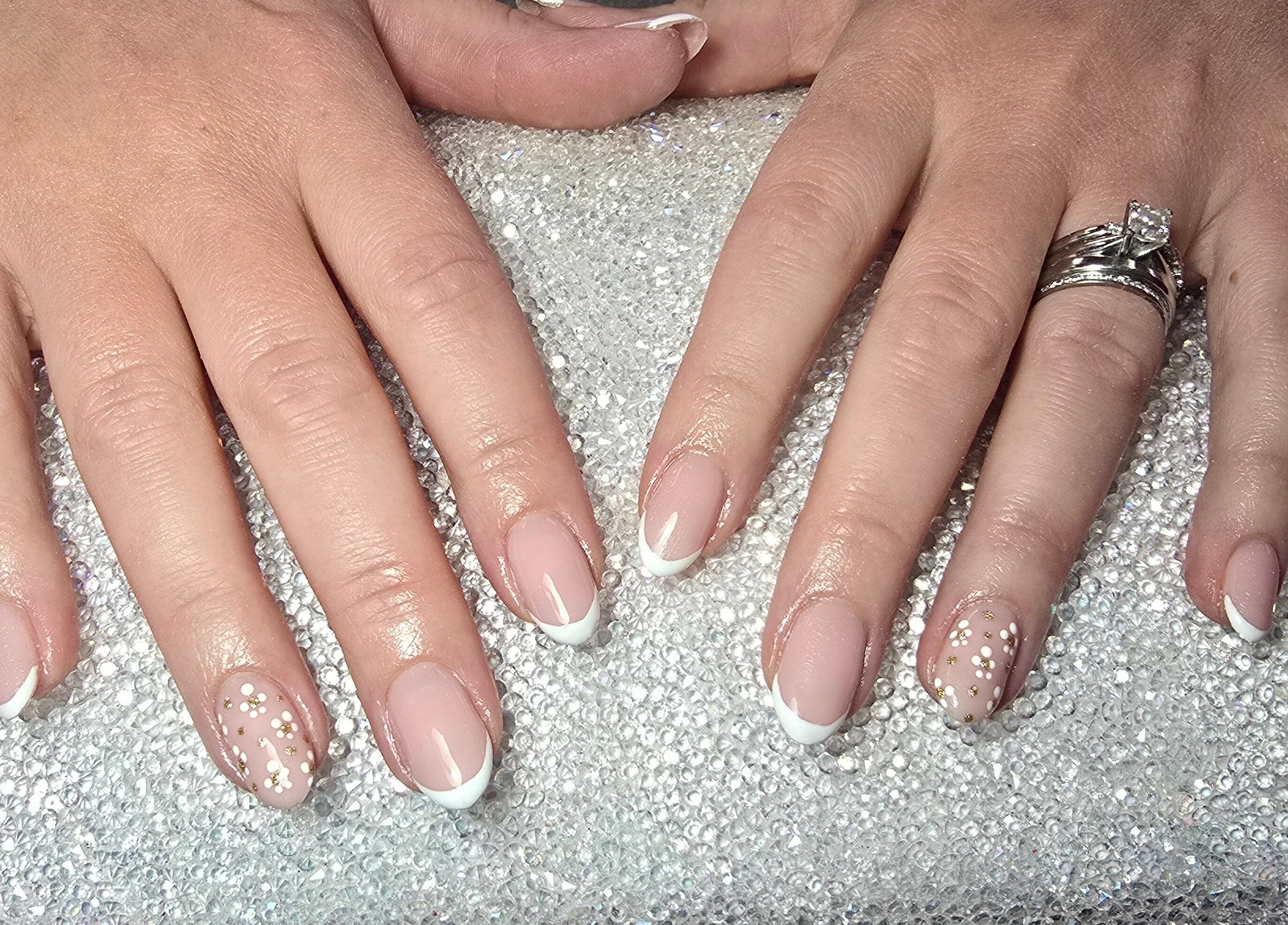 French manicure with floral accents at Nailed It By Laura, Carluke, Scotland, GB.