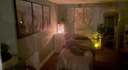 Cozy massage room at Susan Stevens Massage Therapist, Churchdown, England, GB with warm lighting and serene decor.