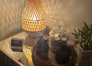 Warm-lit lamp and wellness items at Susan Stevens Massage Therapist, Churchdown, England, GB.