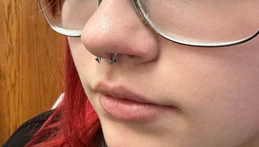 Close-up of a nose piercing at Pierced, Tioga, North Dakota, US showcasing stylish jewelry.