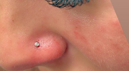 Close-up of a nose piercing with stud at Pierced in Tioga, North Dakota, US showcasing expert craftsmanship.
