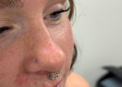 Close-up of nose piercings at Pierced, Tioga, North Dakota, US, showcasing stylish nose rings.