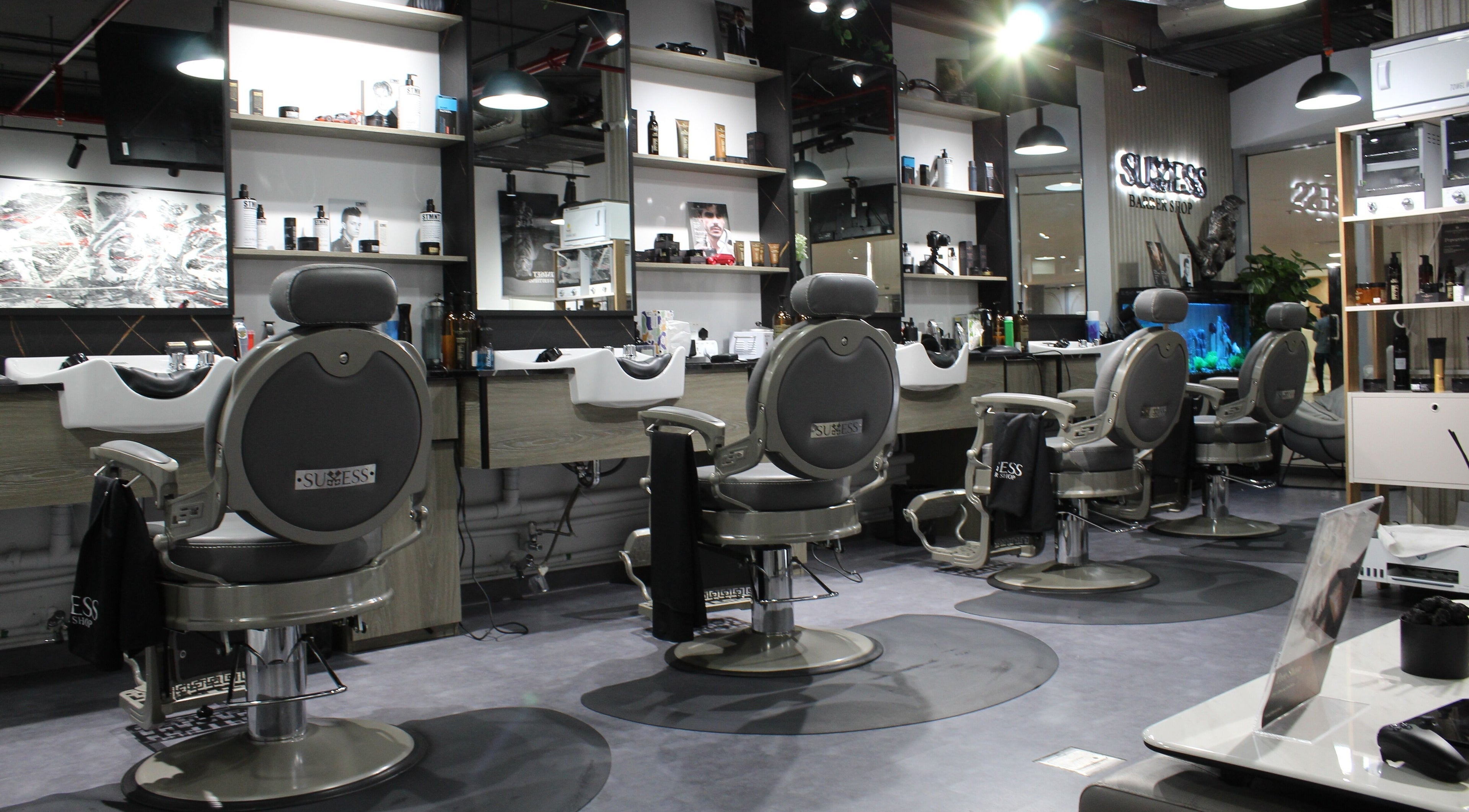 Modern interior of Success Barbershop, featuring sleek barber chairs in دبي, دبي, AE.