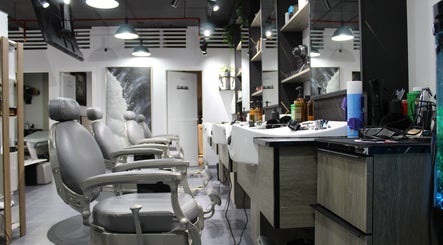 Modern interior of Success Barbershop in دبي, دبي, AE showcasing sleek chairs and stylish decor.