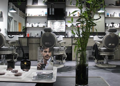 Stylish and modern interior of Success Barbershop located in دبي, دبي, AE, showcasing grooming products.