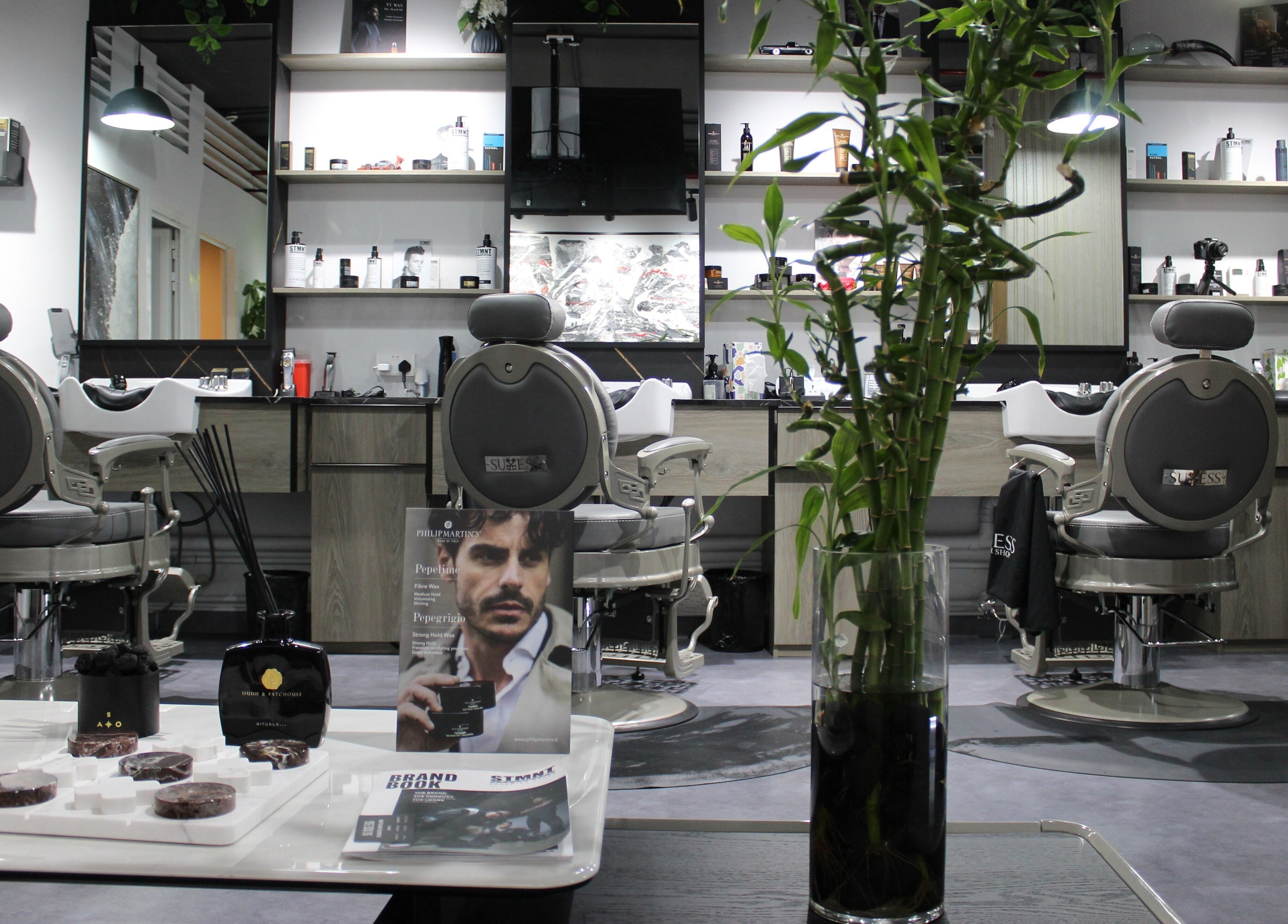 Stylish and modern interior of Success Barbershop located in دبي, دبي, AE, showcasing grooming products.