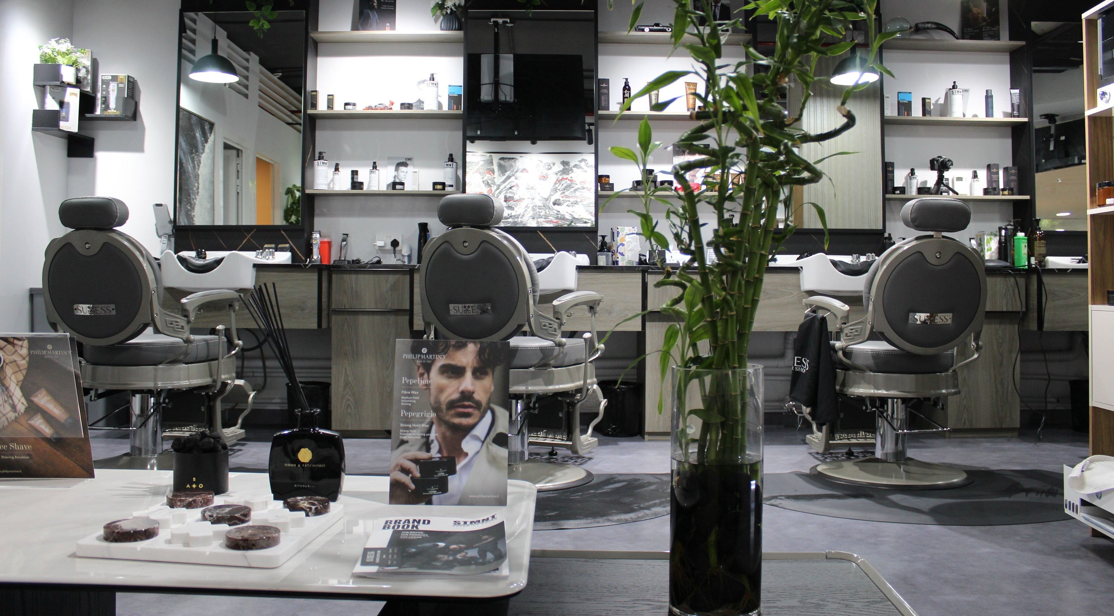 Stylish and modern interior of Success Barbershop located in دبي, دبي, AE, showcasing grooming products.