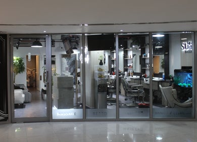 Front view of Success Barbershop in Dubai, AE featuring sleek modern interior and elegant setup.
