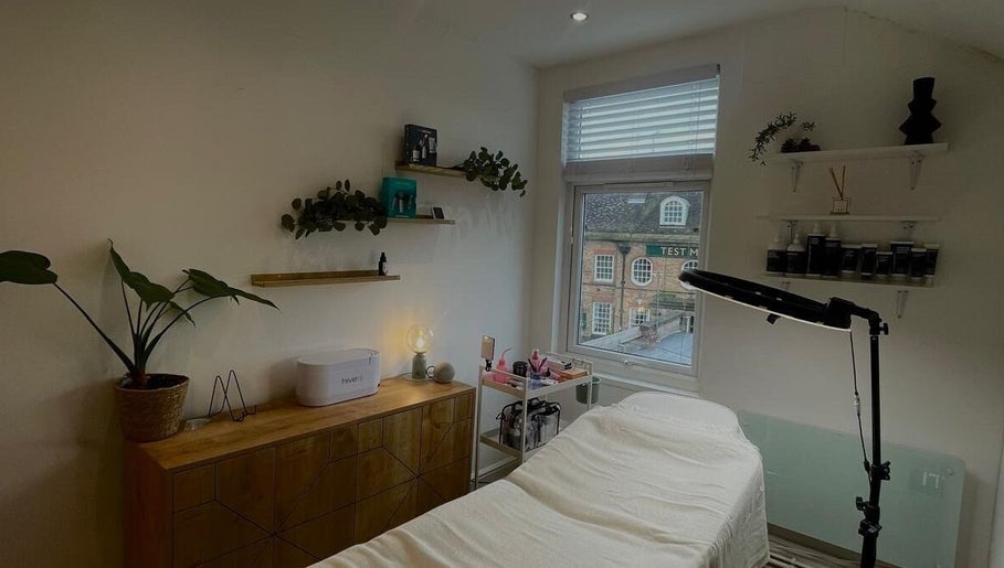 Calm treatment room at Fine Line By V, Long Eaton, England, GB, with soft lighting and elegant decor.