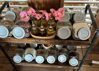 Jars and bottles at MG Organic Spa, Kralendijk, Bonaire, BQ, showcasing natural ingredients and oils.