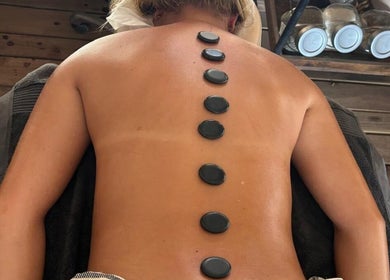 Relaxing hot stone massage at MG Organic Spa, Kralendijk, Bonaire, BQ for a rejuvenating wellness experience.
